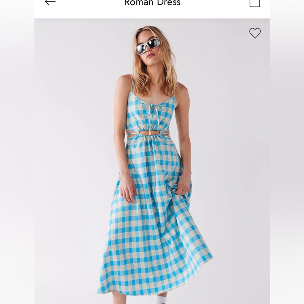 This is a brand new untouched Ghanda dress. This dress is a size small.